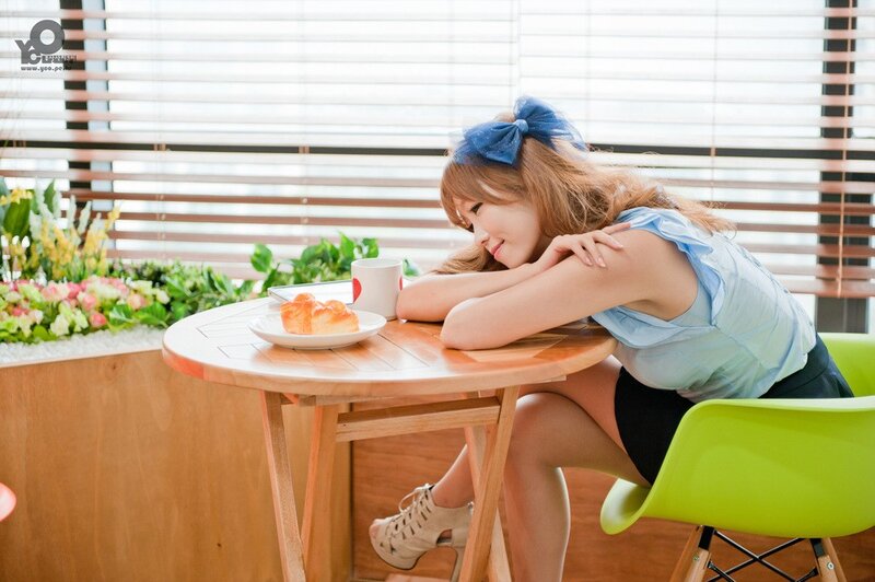 woman at cafe table with pastry