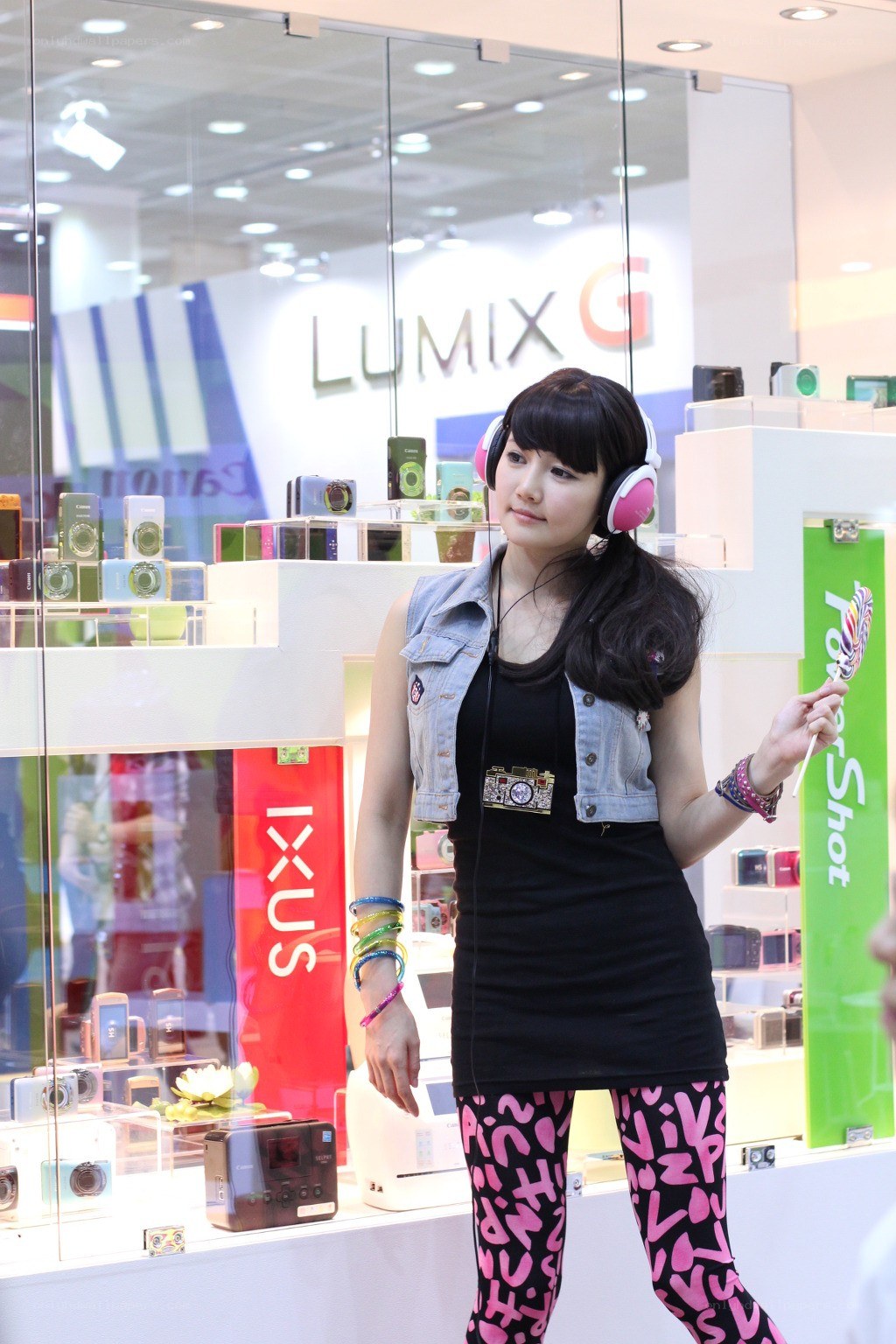 Woman at camera display event