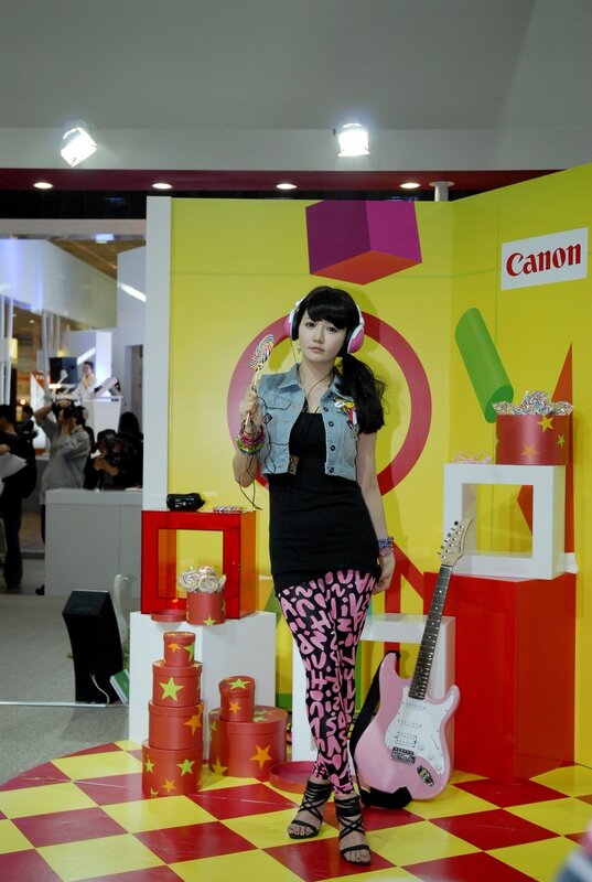 Woman at Canon event with guitar