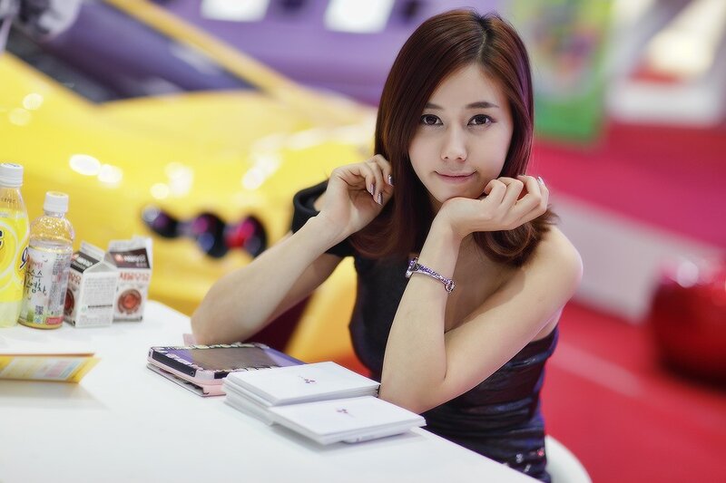 woman at car show booth