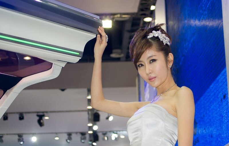 Woman at car show display