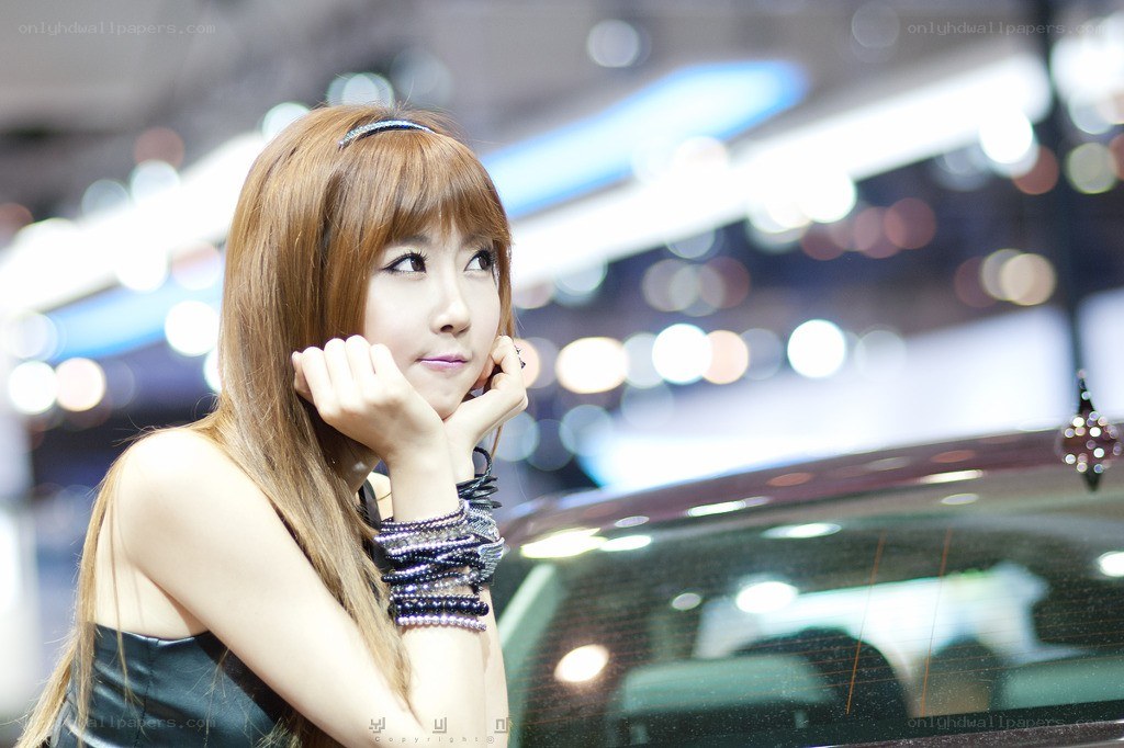 woman at car show posing
