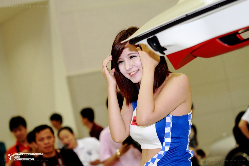 Woman at car show posing