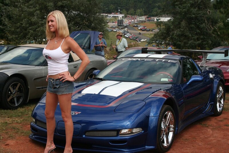 Woman at car show with Corvette