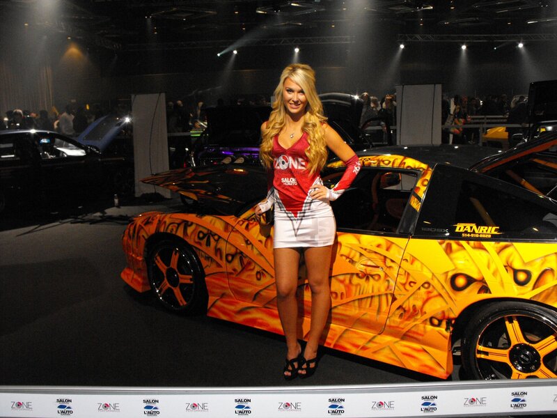 Woman at car show with custom car