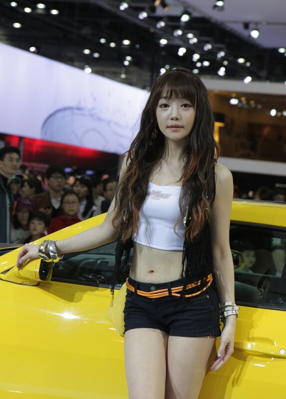 Woman at Car Show — Yellow, Neutral, Night