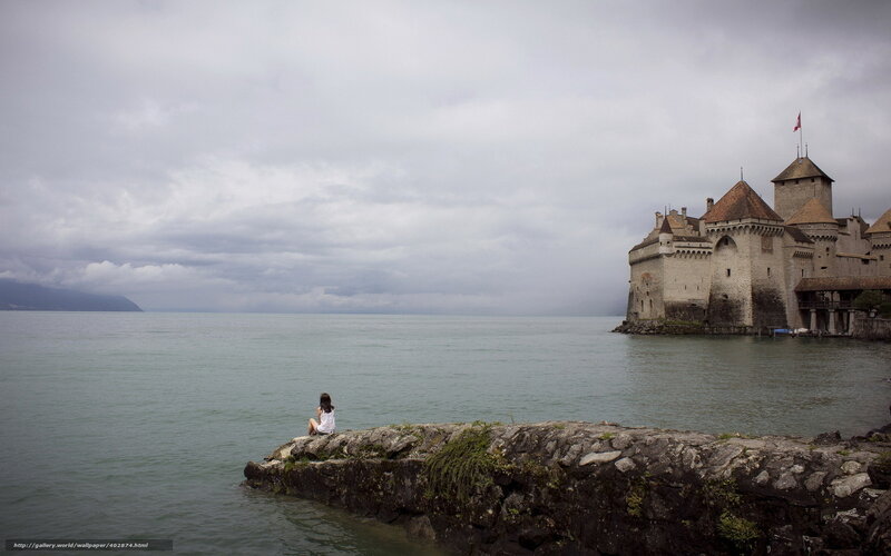 Woman at castle by the lake