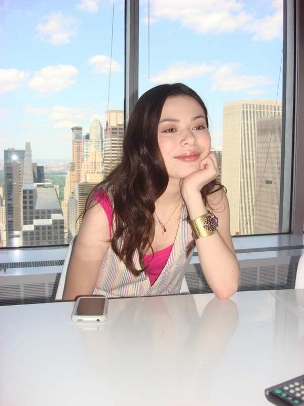 woman at desk with city view