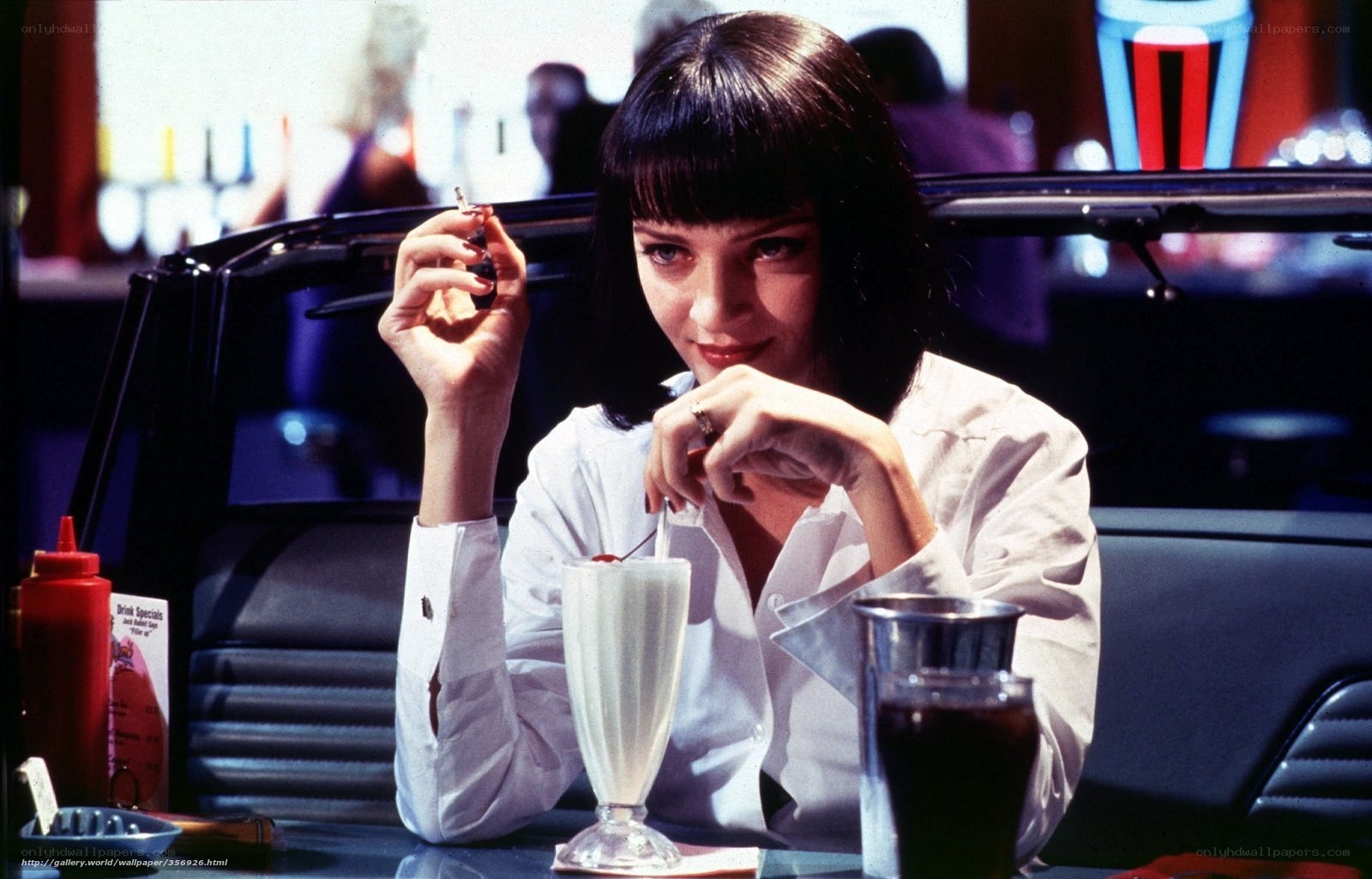 Woman at diner with milkshake