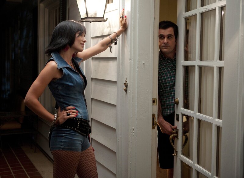 Woman at door with man inside