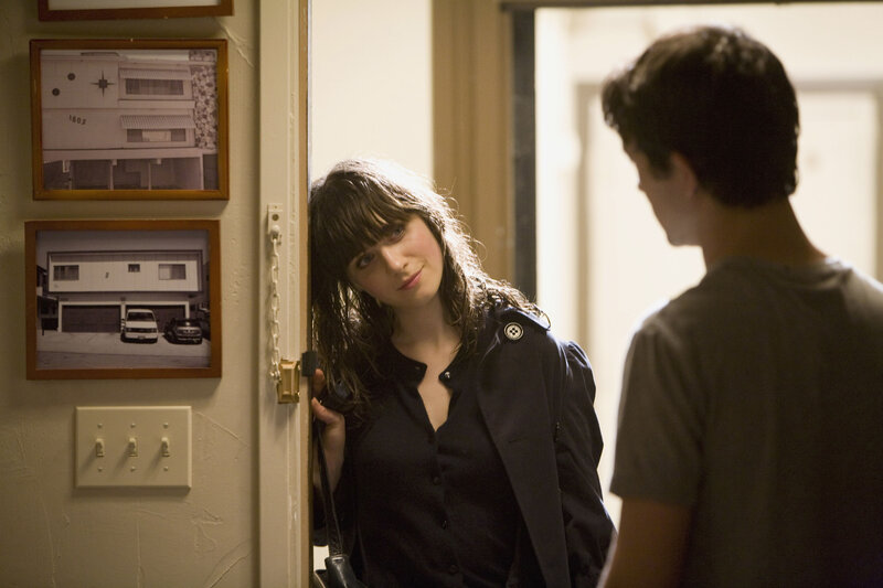 Woman at doorway with man