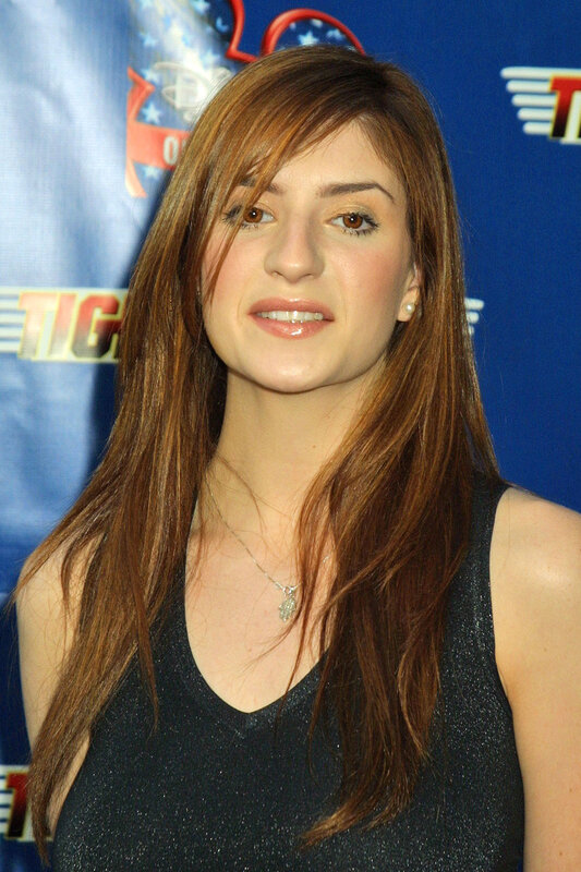 woman at event with blue backdrop