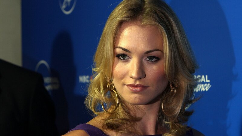 woman at event with blue backdrop