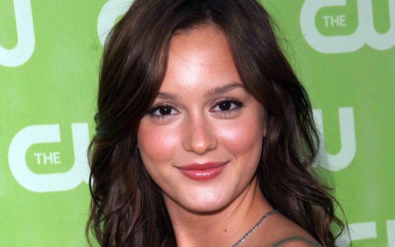 woman at event with green background
