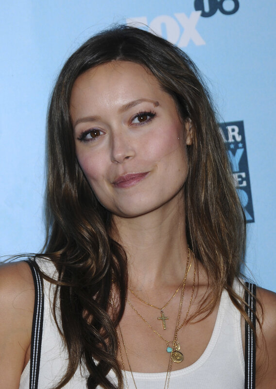 woman at event with layered necklaces