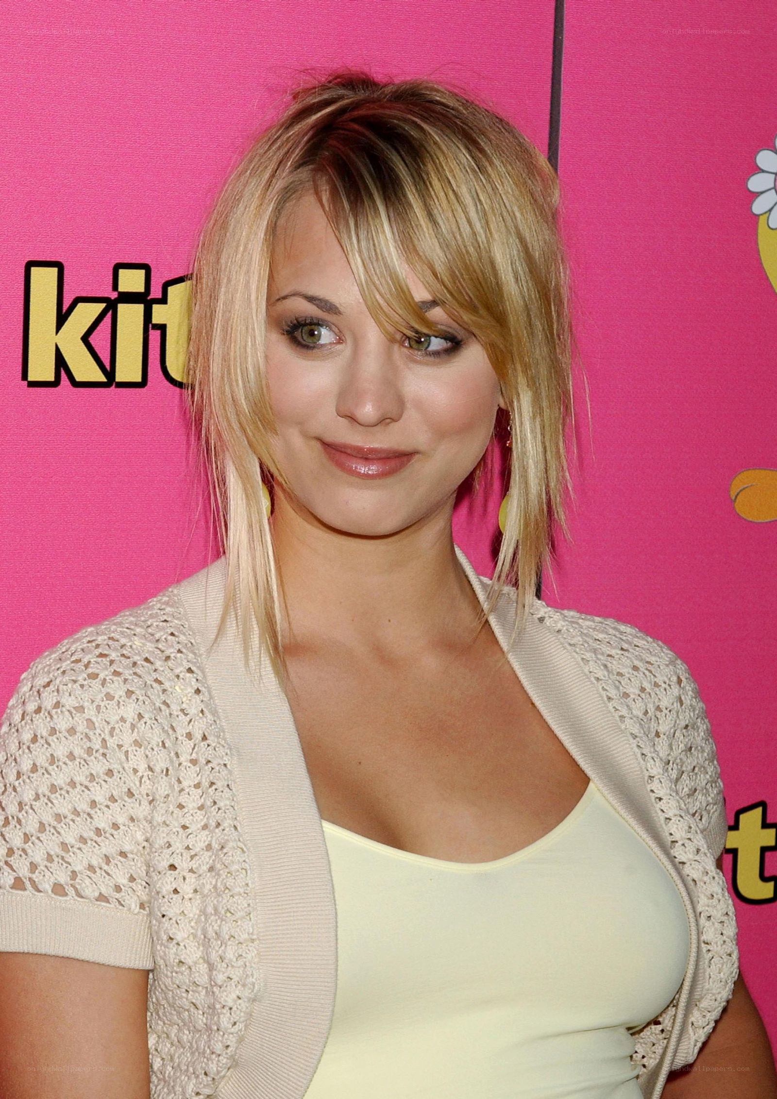 woman at event with pink background