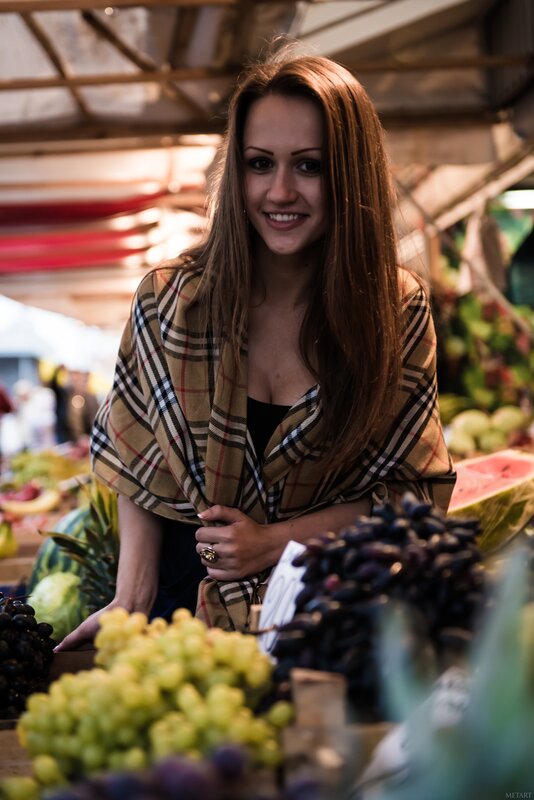Woman at fruit market stall