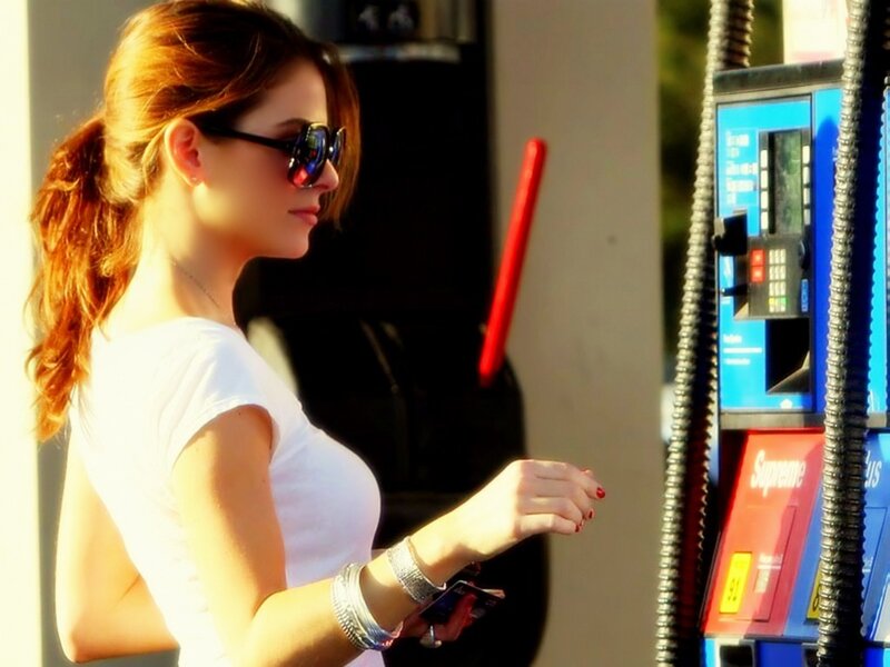 Woman at Gas Pump — White