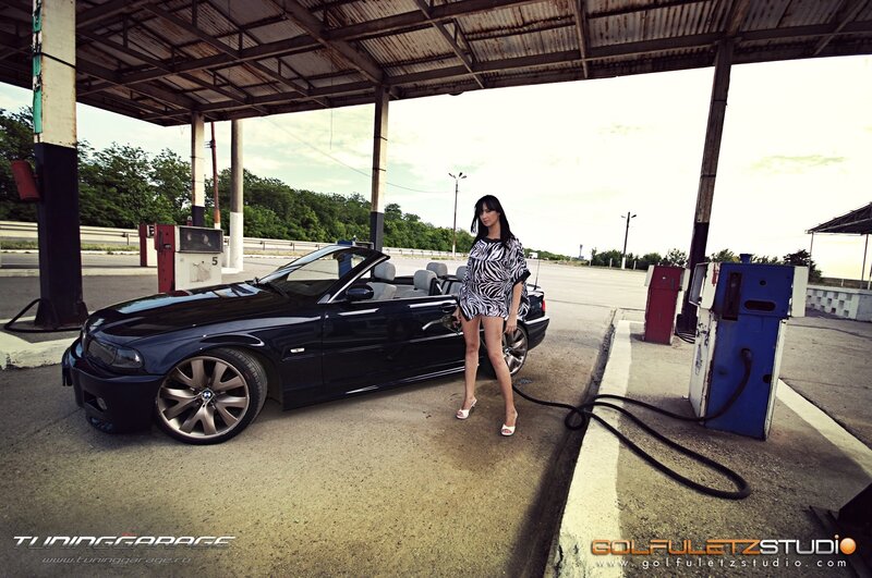Woman at gas station with convertible