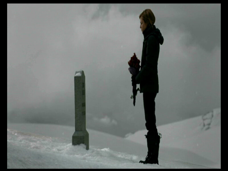 Woman at Grave in Snow