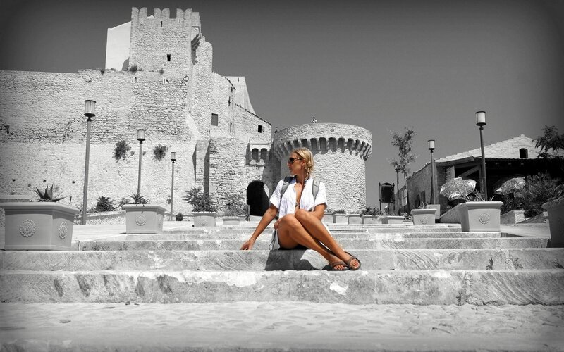 Woman at historic castle steps