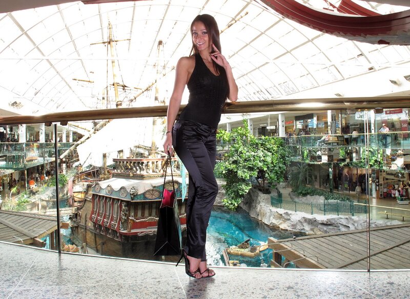 Woman at indoor mall with ship