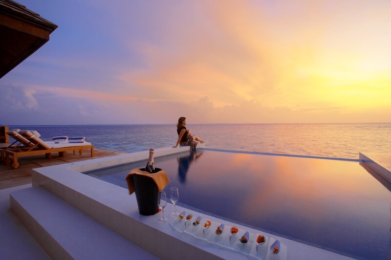 Woman at Infinity Pool — Blue, Serene, Sunset