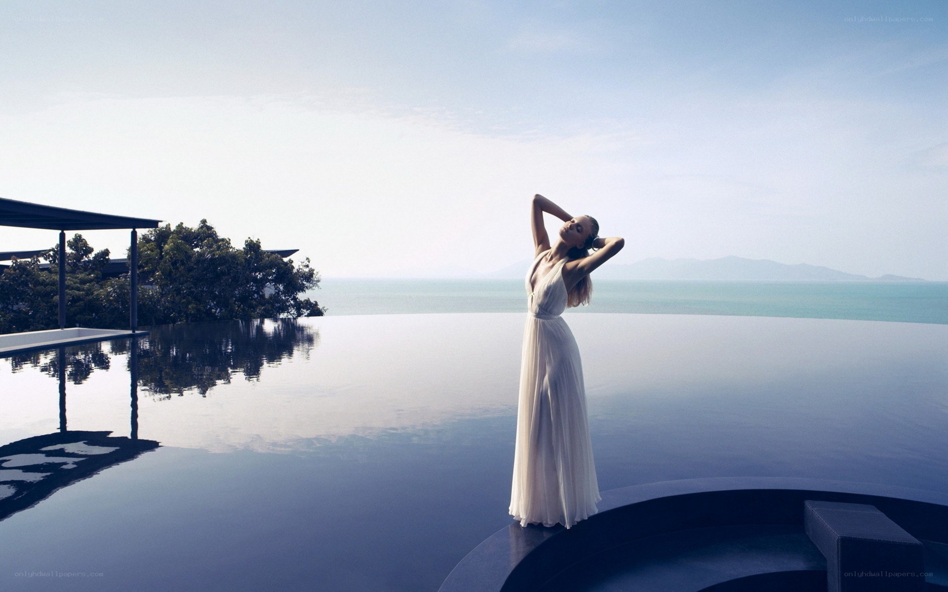 Woman at infinity pool
