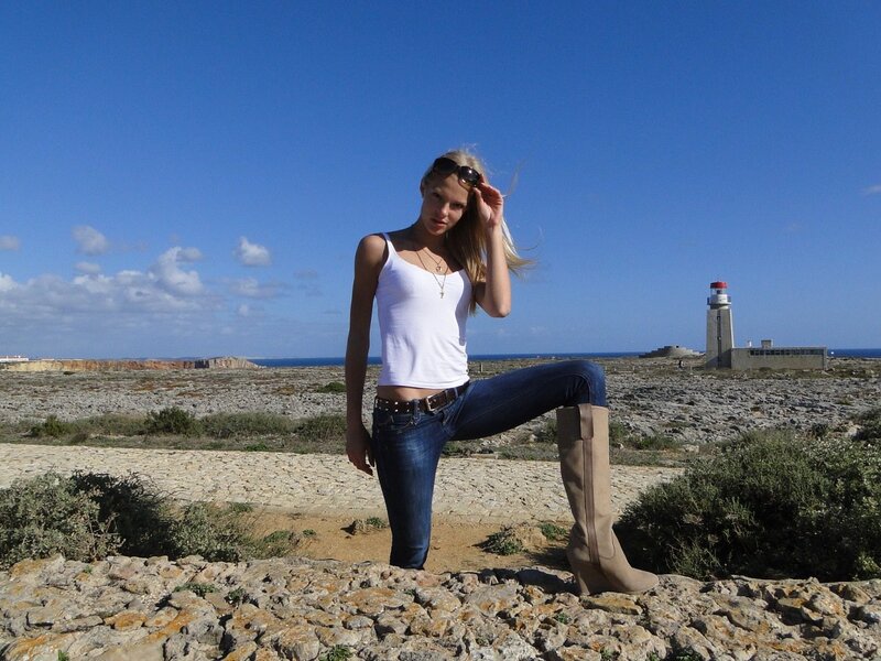 Woman at lighthouse by the sea