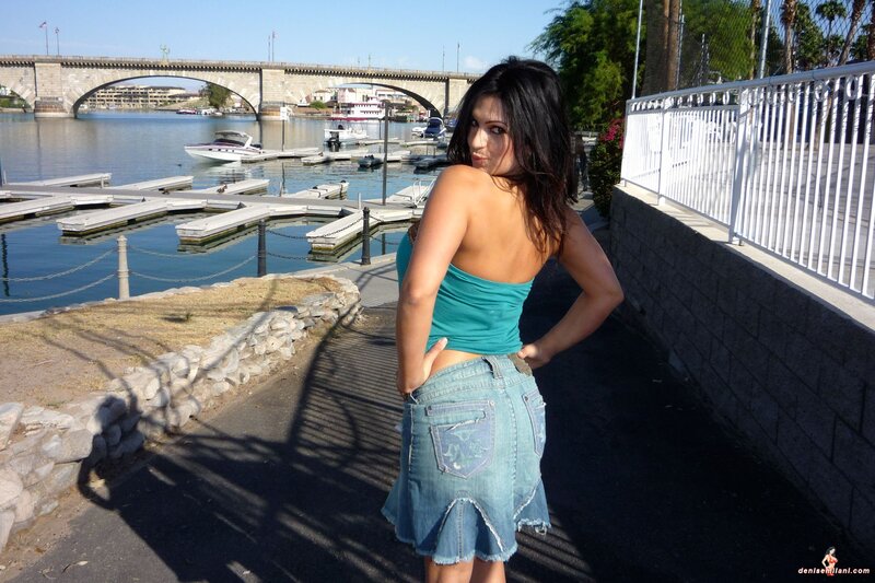 Woman at marina with bridge