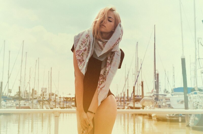 woman at marina with scarf
