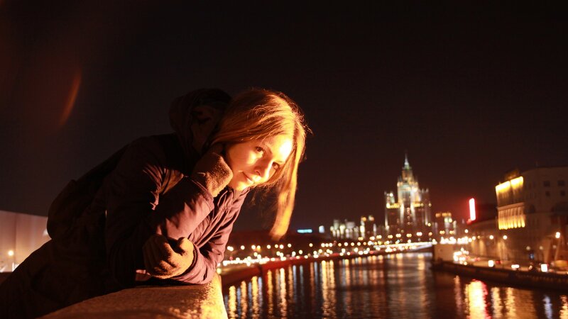 woman at night by the river