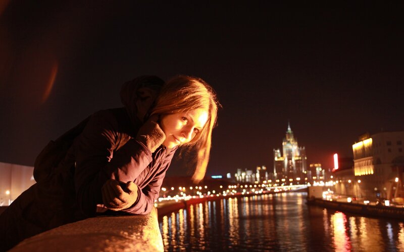 Woman at night by the river