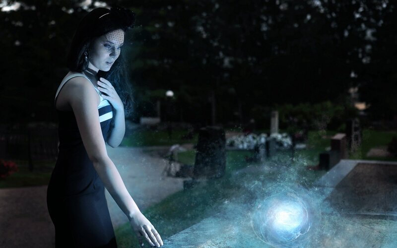 woman at night with glowing orb