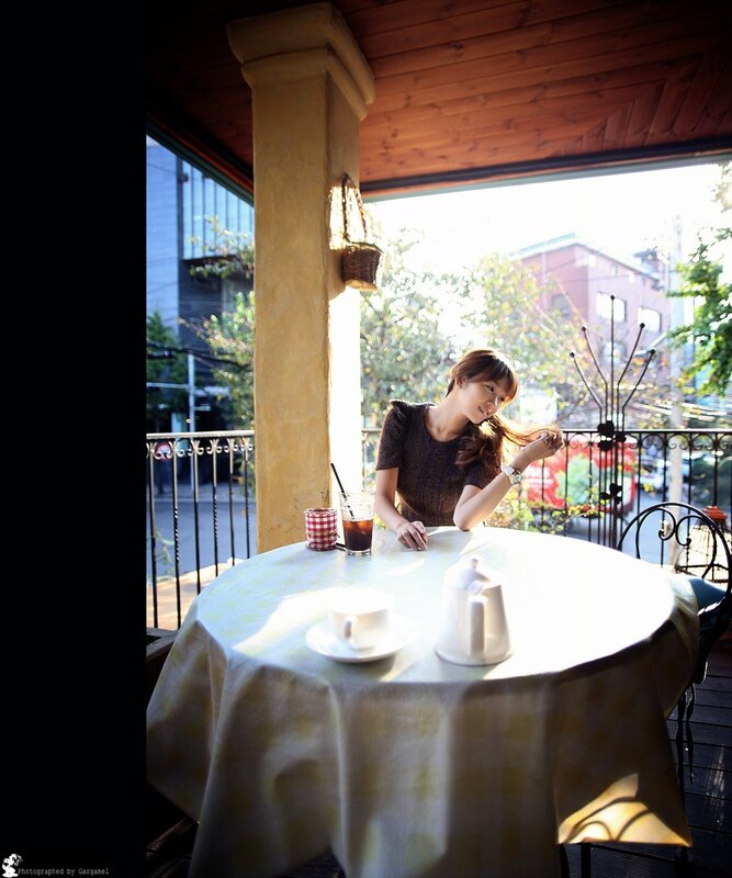 Woman at Outdoor Table — White, Serene