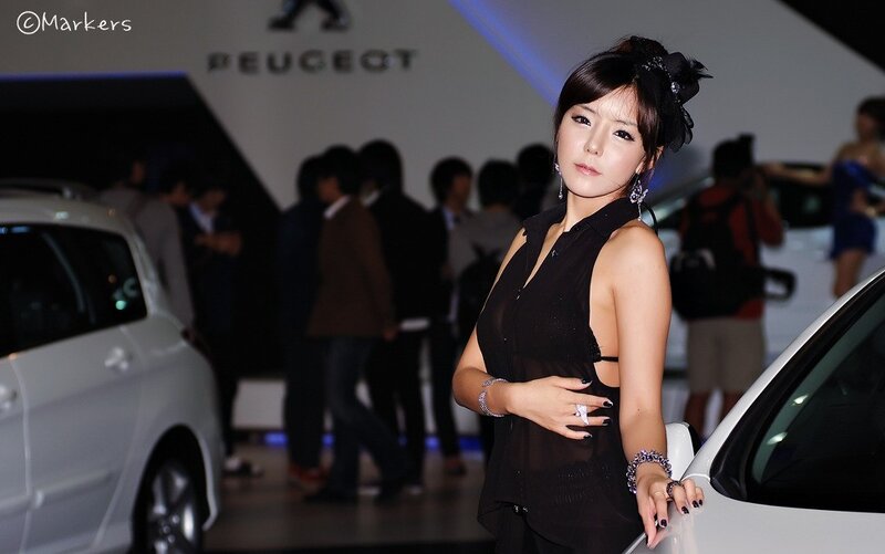 Woman at Peugeot auto show