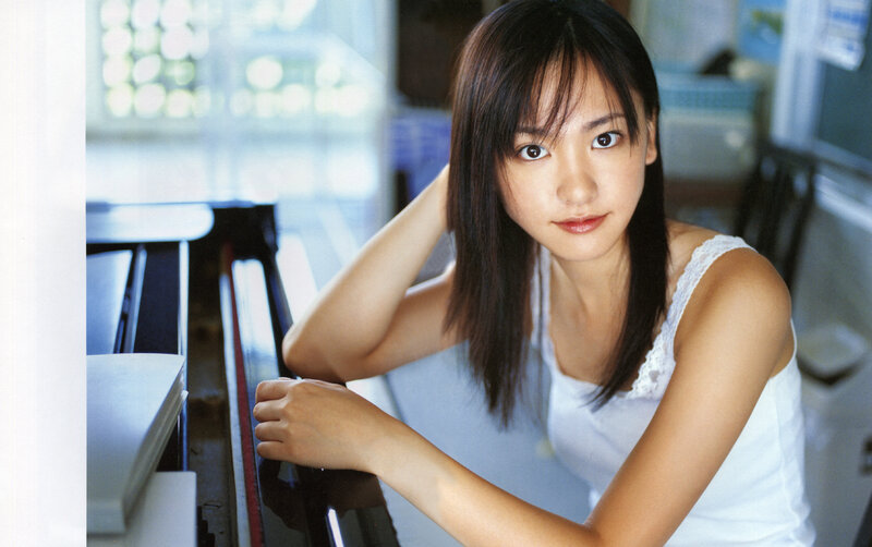 woman at piano in white top