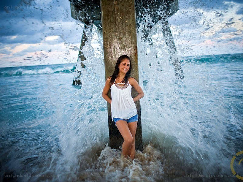 woman at pier during wave