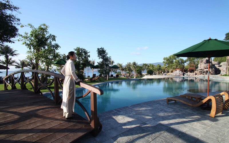 Woman at poolside resort