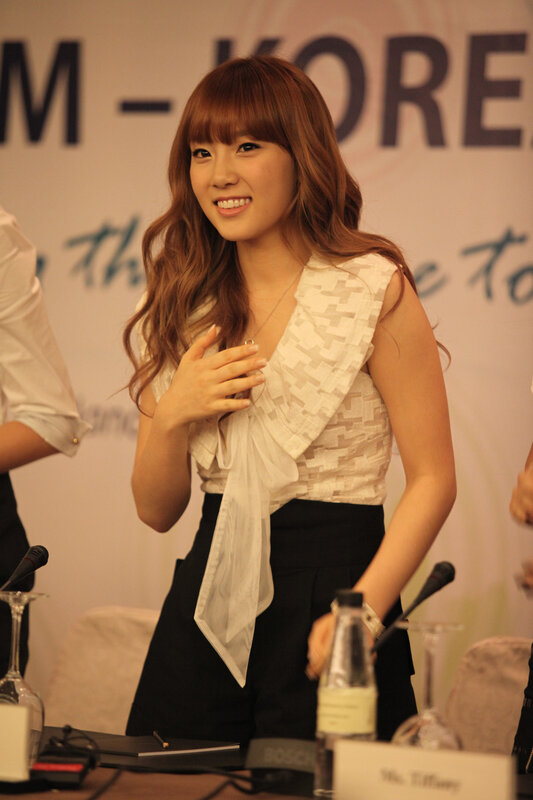woman at press conference smiling