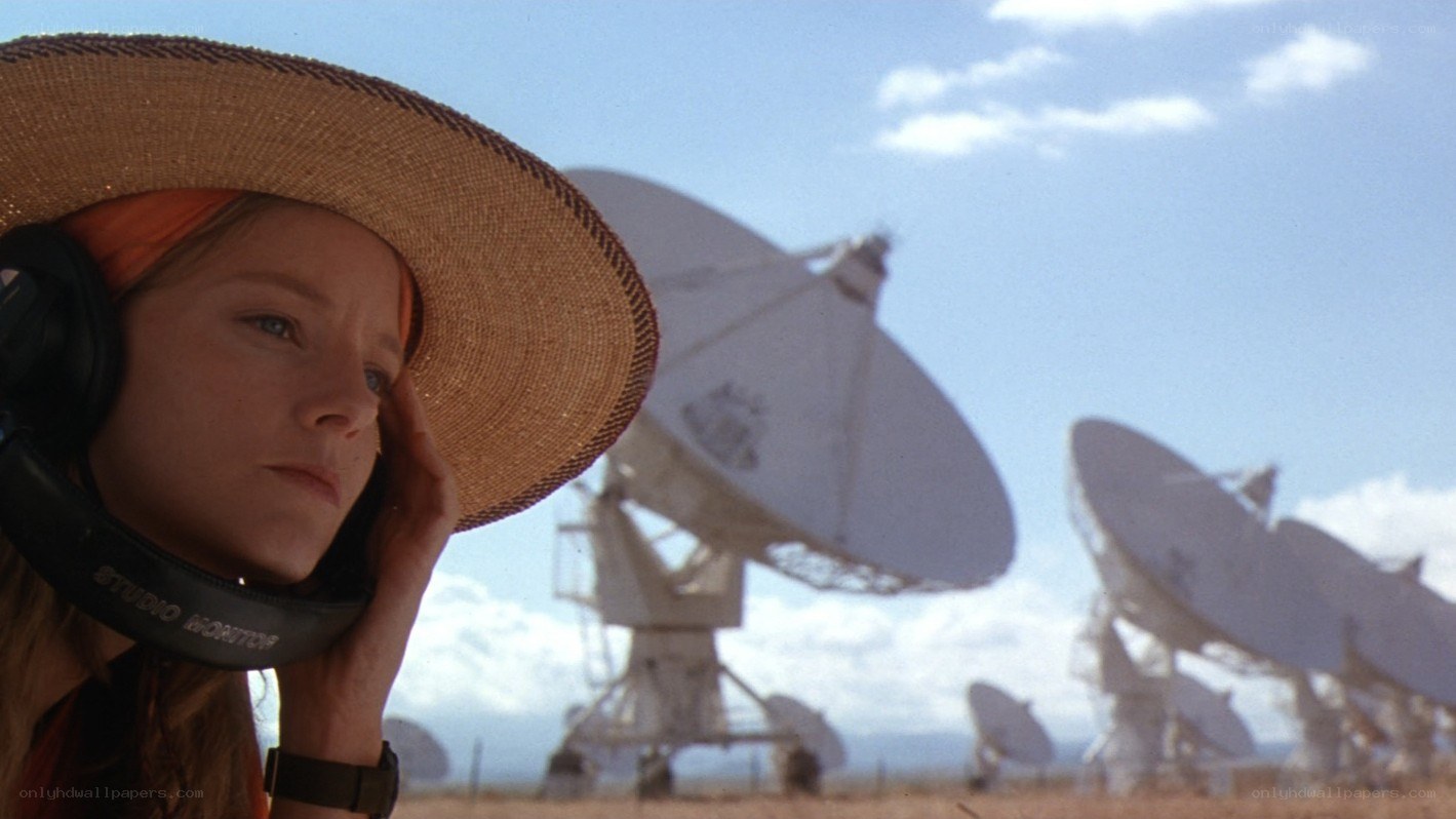 woman at radio telescope array