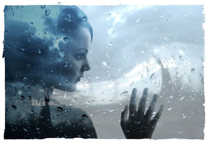 Woman at Rain-covered Window