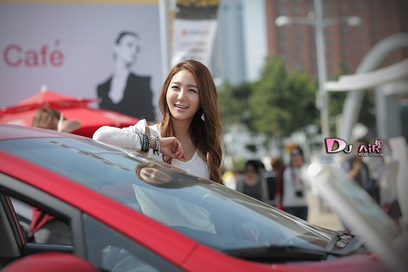 woman at red car event