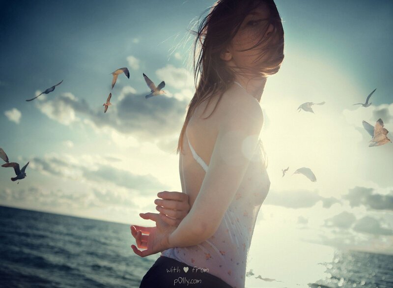 woman at seaside with birds