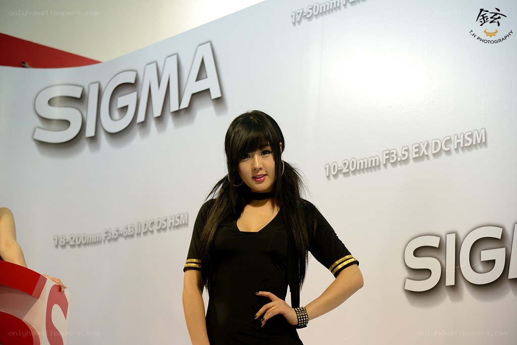 Woman at Sigma camera booth