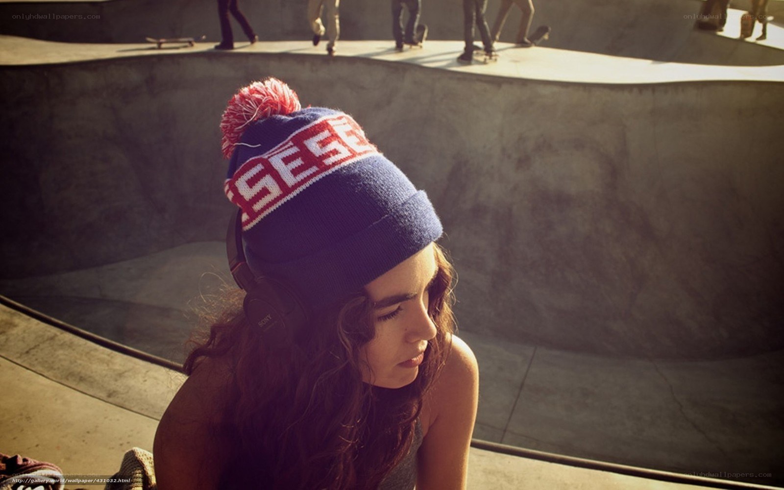 woman at skate park with headphones