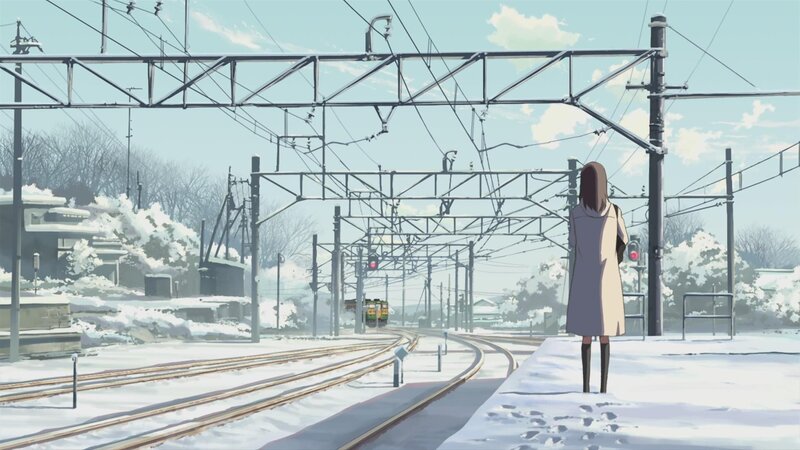 woman at snowy train station