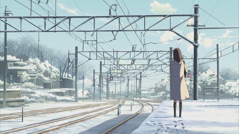 woman at snowy train station