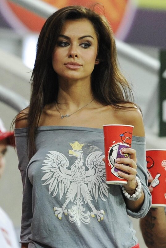 woman at stadium with cup