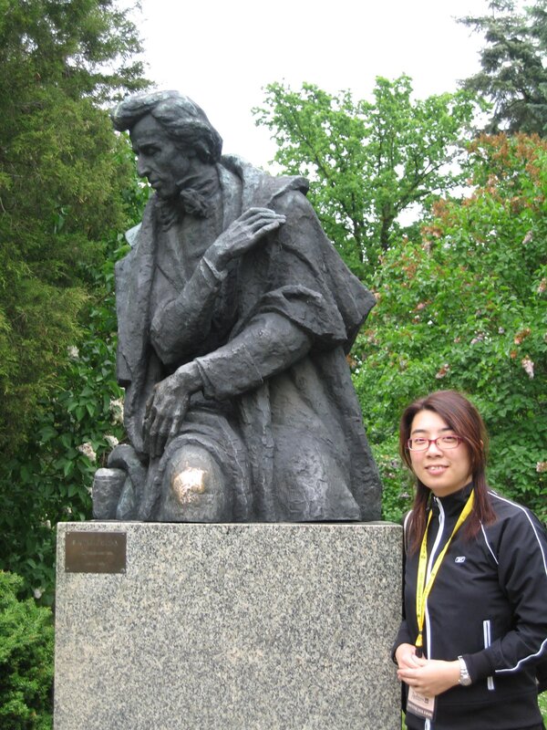 woman at statue in park